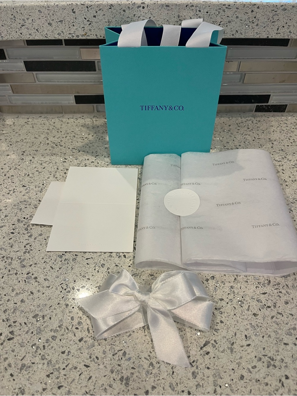 NWOT Tiffany & Co. Gift Bag, Tissue Paper
Ribbon and Tiffany enclosure Card